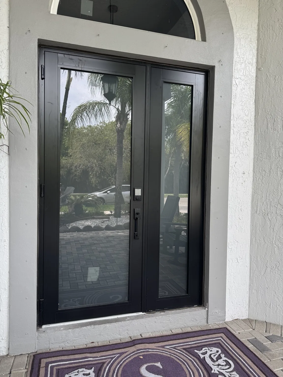 Completed black impact double entry door installation