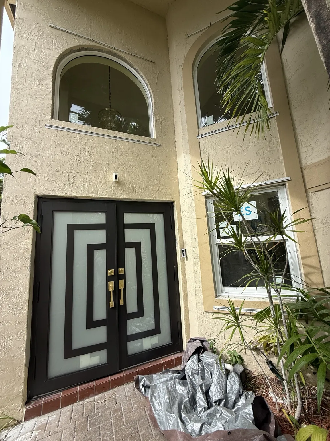 Completed geometric black impact double entry doors with frosted glass