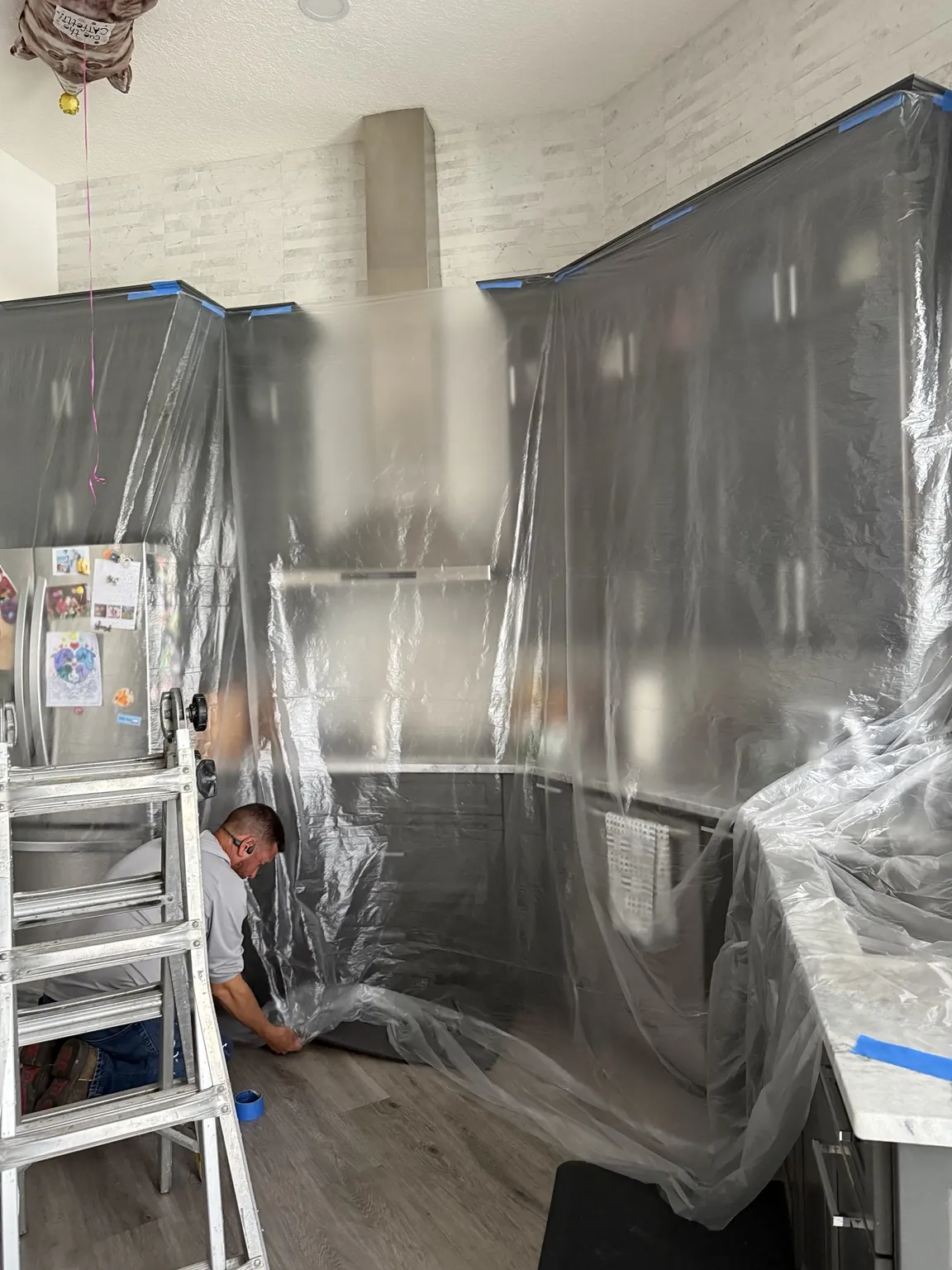 Installer working inside a fully protected room